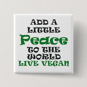 Un pequeño botón de la paz del vegano