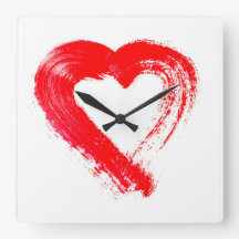 Un reloj de pared del corazón rojo
