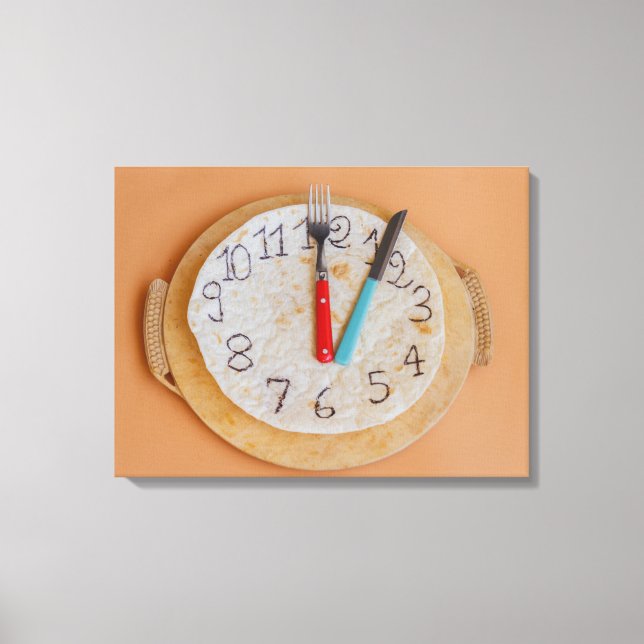 un reloj hecho de impresión de lienzo envuelto en  (Anverso)
