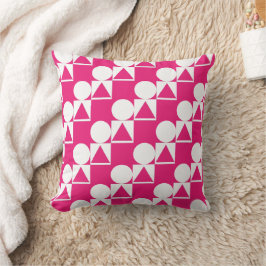 Una almohada con un círculo, un triángulo y un pat