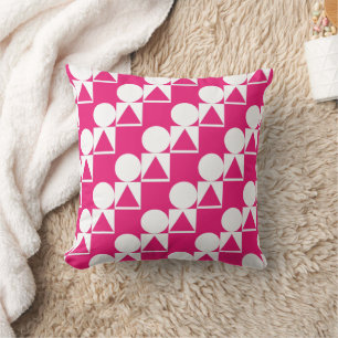Una almohada con un círculo, un triángulo y un pat