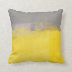"" Una almohada gris y amarilla abstracta simple