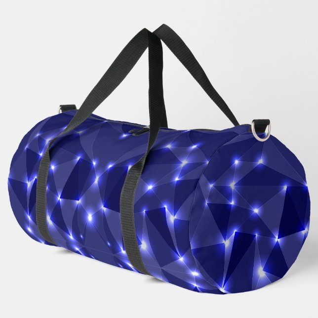 Una bolsa de viaje con un diseño geométrico azul (Esquina izquierda)
