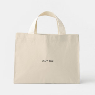 Una bolsa tote beige con asas blancas