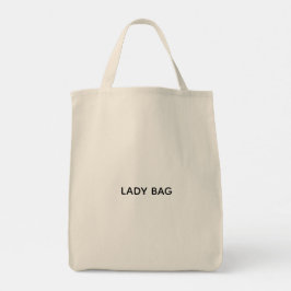 Una bolsa tote beige con el texto "LADY BAG" impre