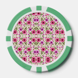 Una ficha de póquer con un patrón floral en rosa 
