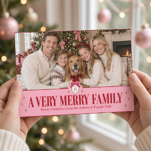 Una foto de Navidad con cresta de lazo rosa de una