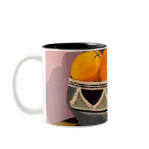 Una magnífica taza con naranjas pintando el diseño