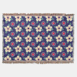 Una manta azul marina con flores de crema