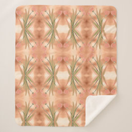 Una manta con una impresión de tulipanes rosados y