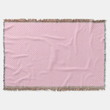 Una manta decorativa rosa con un sutil 