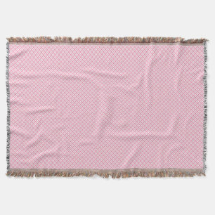 Una manta decorativa rosa con un sutil