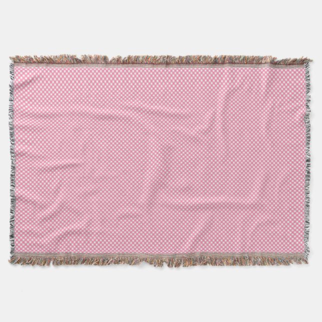 Una manta tejida rosa con un patrón sutil (Anverso)