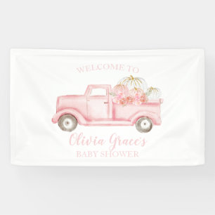 Una pancarta de camión rosa para baby shower de un