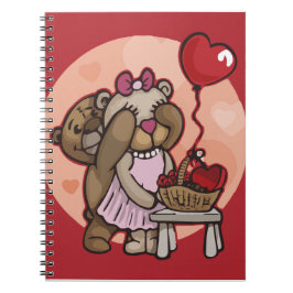 Una pareja de peluche con cuaderno de espiral roja