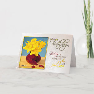 Una tarjeta de cumpleaños con daffodis dorados