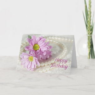 Una tarjeta de cumpleaños con margaritas