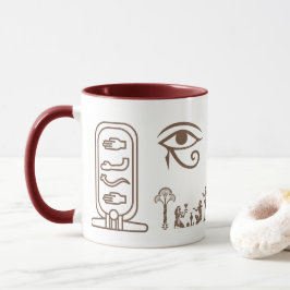 Una taza de cerámica con un diseño del antiguo Egi