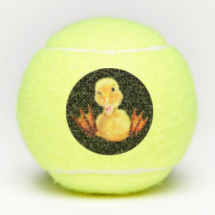 Unas divertidas bolas de tenis con un pato feliz