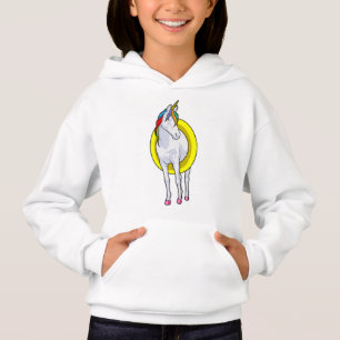 Unicornio en natación con anillo de natación