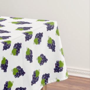 Uvas sobre mantel blanco