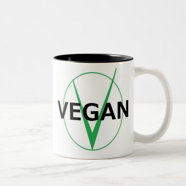 V está para la taza del coffie del vegano (Derecha)