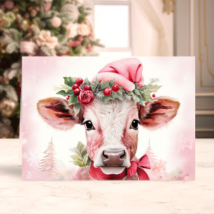 Vaca de Navidad adorable con sombrero de Santa