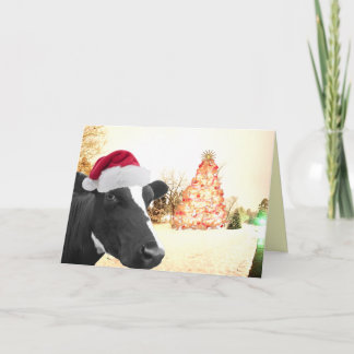Vaca del invierno del navidad de Mooey en el gorra