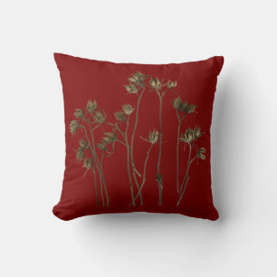 Vainas de semillas en una almohada de lanzamiento
