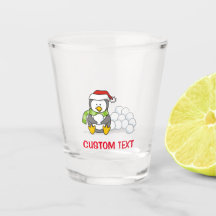 Pingüino navidad sentado con bolas de nieve