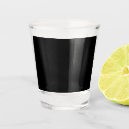Vaso De Chupito Una superficie negra texturizada con un patrón de 