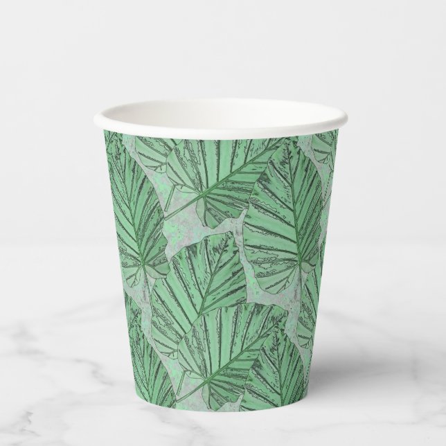 Vasos De Papel Hojas verdes sobre una piedra gris. (Anverso)