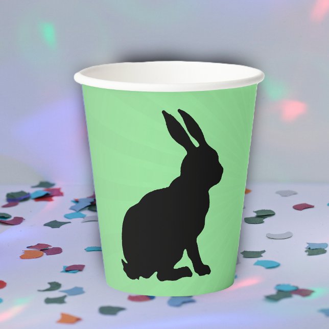 Vasos De Papel Silhouette negra sentando al conejito oidos altos  (Sitting black silhouette bunny rabbit on green paper party drinking cup.)