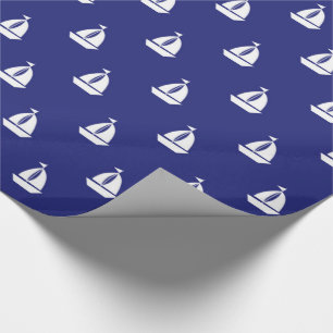 Vela lejos en el papel de regalo azul