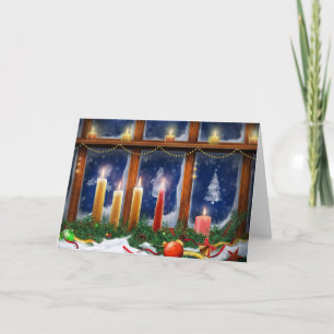 Velas en la tarjeta de Navidad de la ventana