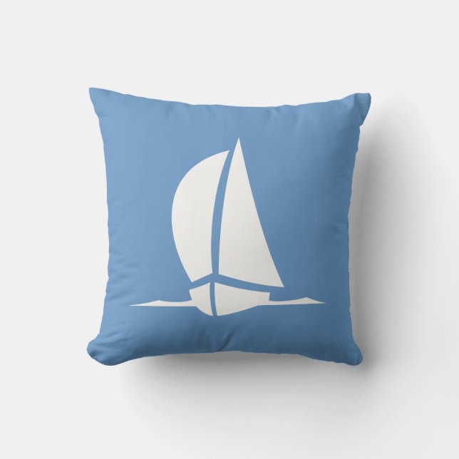 velero blanco sobre almohada azul (Anverso)