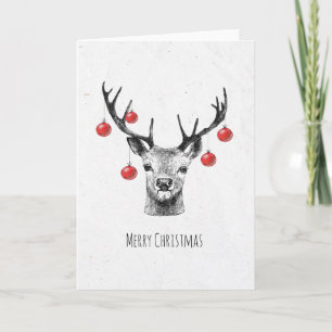 Venado con bolas de Navidad dibujando