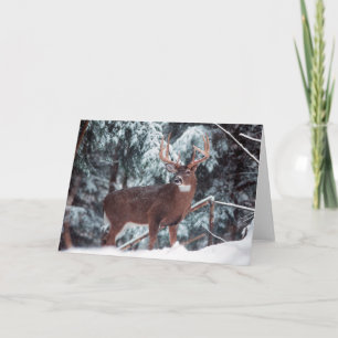 Venado en la tarjeta de saludo de nieve