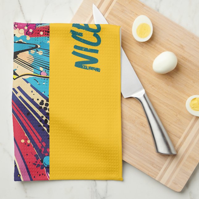 Vibrante toalla de cocina con un diseño lúdico (Doblado Cuarto)