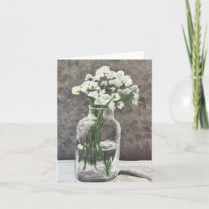 Vida: Flores blancas en un frasco transparente