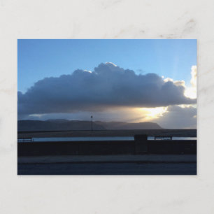 Vigas de sol sobre postales de Conwy