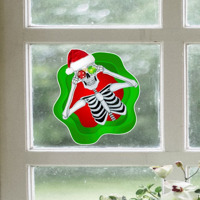 Vinilos Para Cristales Navidades Divertidos Esbozos En Ornamentos En Form (Fun skeleton Santa Hat holding ornaments in green red spatter on window cling Christmas Decoration.)