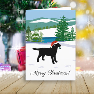 Vista de invierno de Navidad de Labrador negro