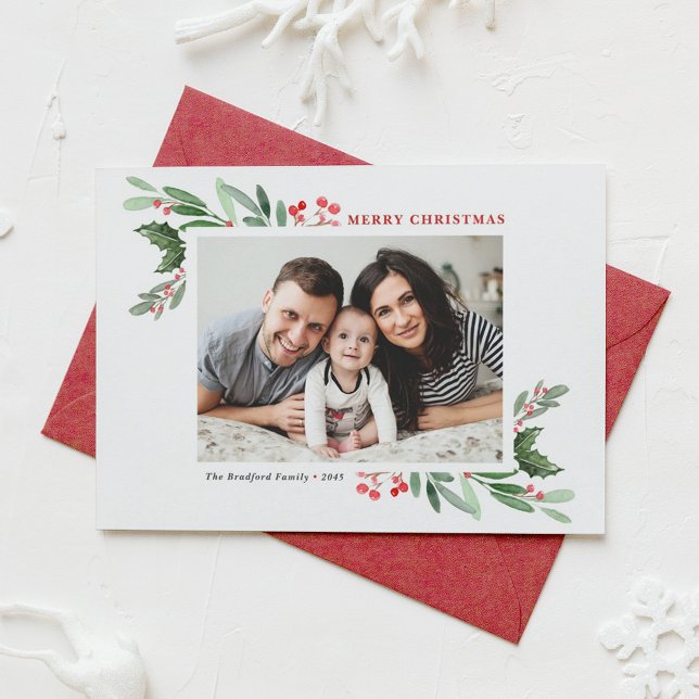 Watercolor Holly Greenery Foto Feliz Navidad (Customizable photo Christmas card featuring watercolor red winterberry and greenery)