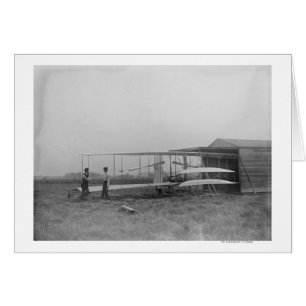 Wilbur y Orville Wright en una máquina de segunda